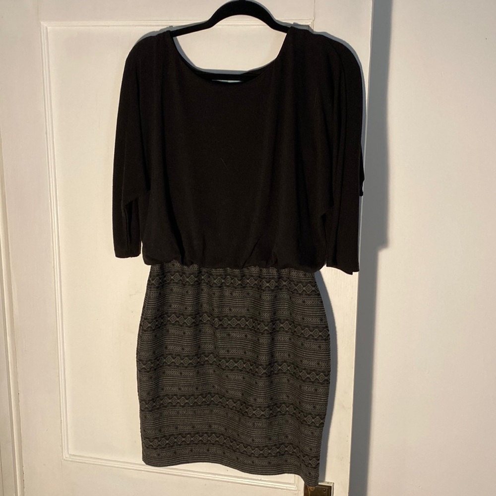 Black dress with fitted bottom and draped top